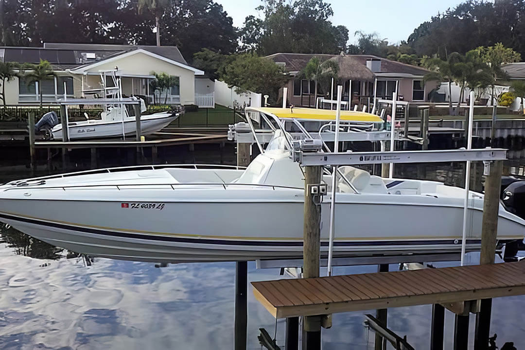 4-Pile Boat Lift with a Boat Centered on the Lift - BOAT LIFT US